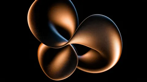 A twisted copper ribbon loops into a three-lobed knot, floating alone against black.