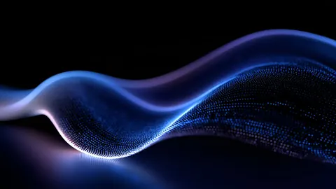 A ribbon of fine blue and violet particles waves across a dark background.