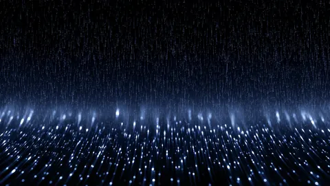 Sparks of blue-white light rain down onto a glittering field below.