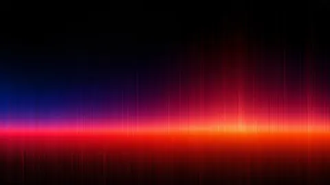 A band of red and orange light burns across the middle, with thin red fins rising above it into blue shadow.