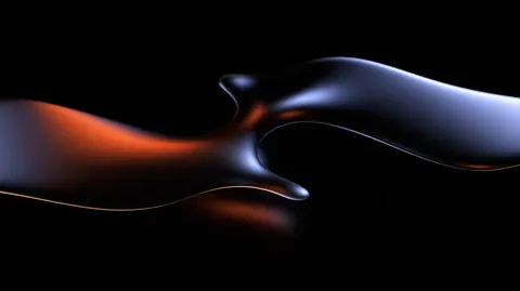 A glossy liquid ribbon stretches across black, glowing orange at one end and cool blue at the other.