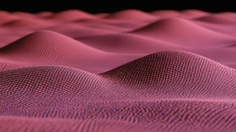 Rolling dunes of rose-pink woven texture under a dark sky.