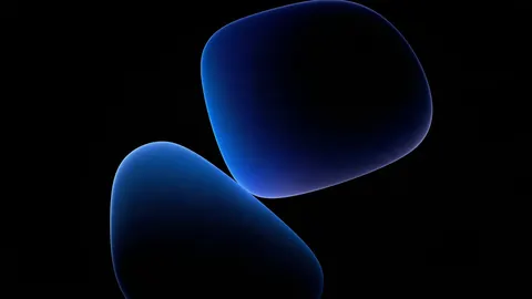 Two smooth sapphire pebble shapes hover in black, outlined by a soft blue glow.